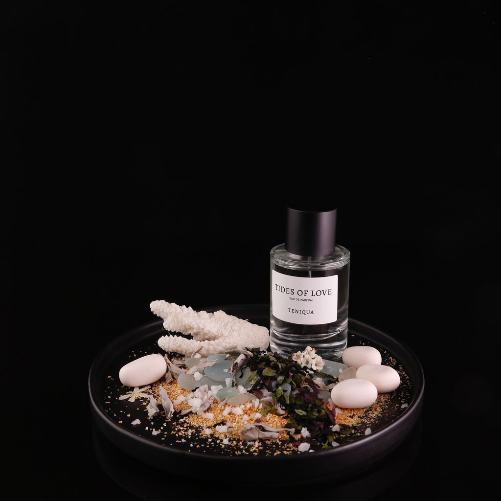 Bottle of Tides of love edp on plate with ingredients highlighted against black background