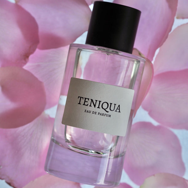 Mysuru Amber Eau de Parfum from Teniqua on a bed of rose petals